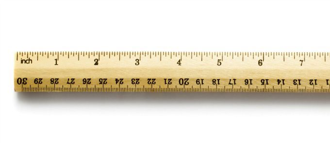 Wooden ruler isolated on white background