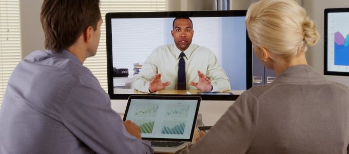 Businessteam listening to manager in a video conference