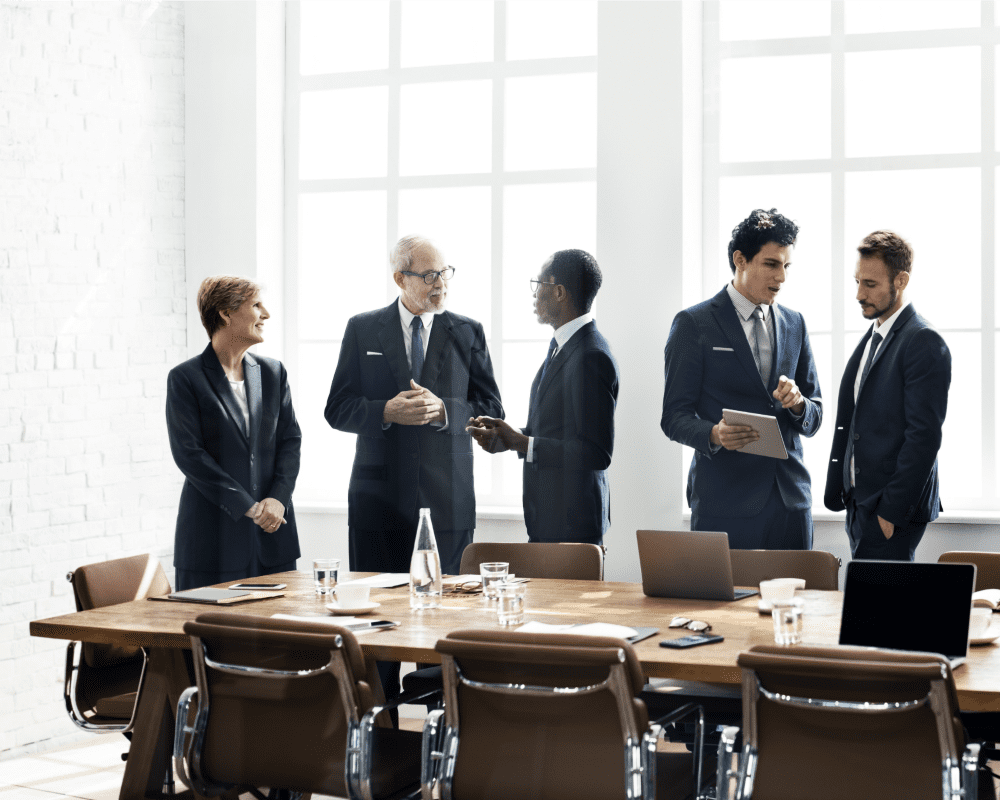 Business people talking around a meeting table