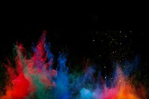 Launched colorful powder, isolated on black background