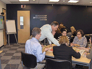 One of Voya's learning and development consultants lead a course on situational leadership for new managers in the company's Windsor, Connecticut office. 