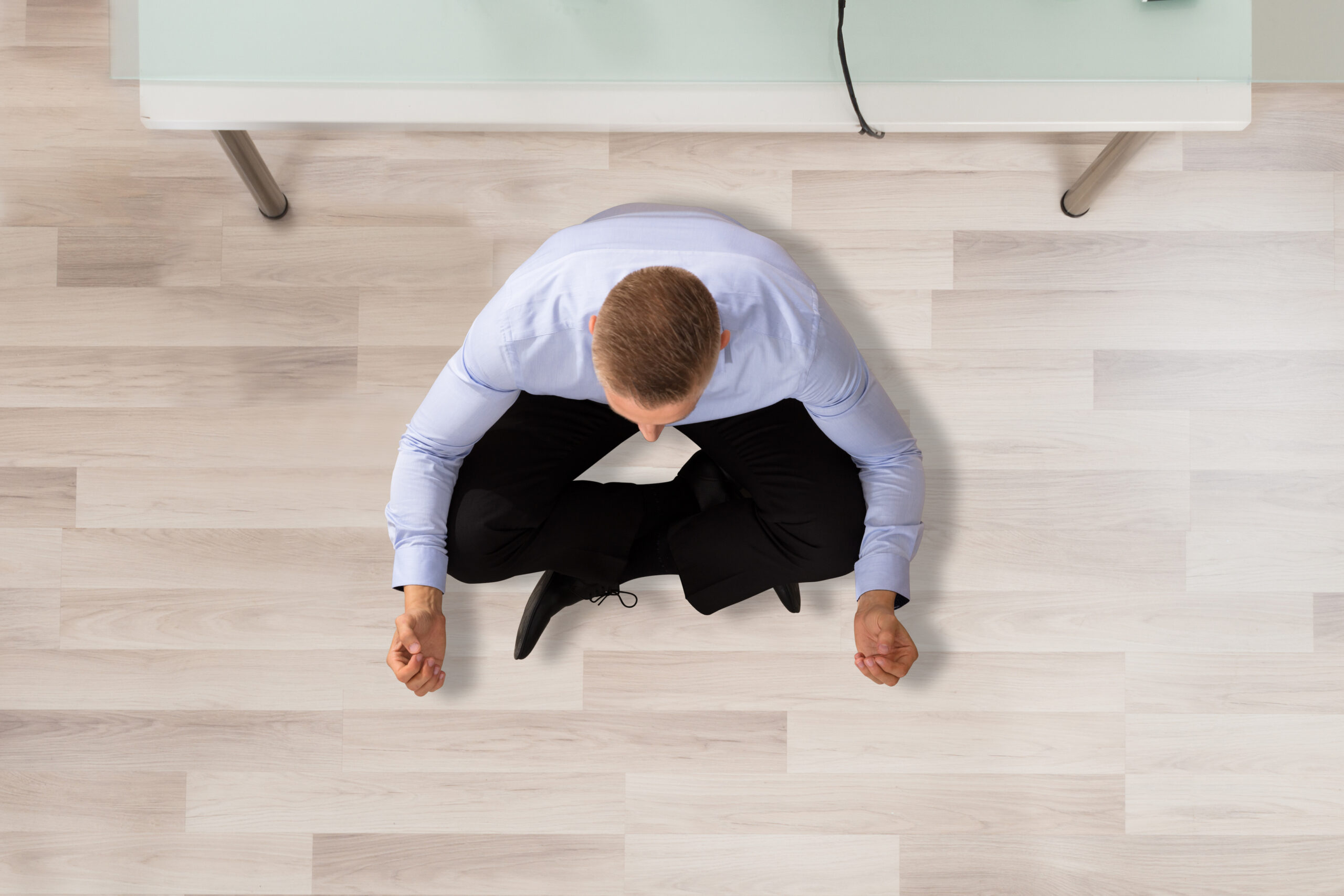 Businessman Doing Transcendental Meditation In Office