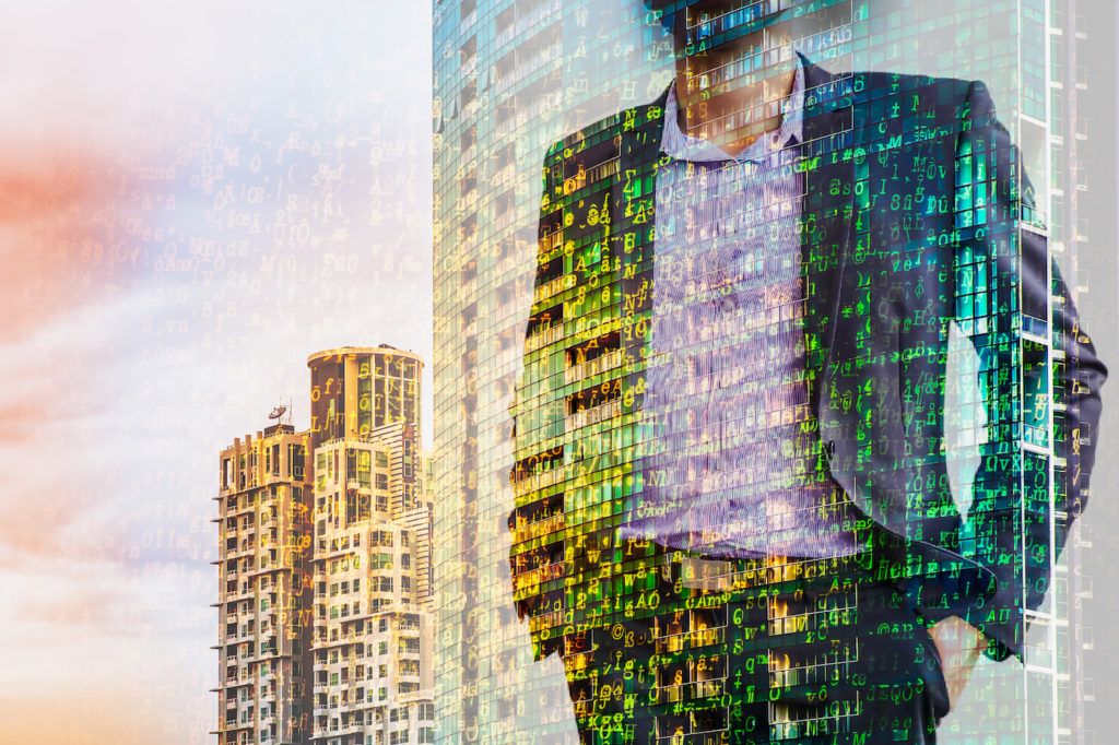 Digital business revolution concept. Double exposure of business man standing and abstract digital coding on building.